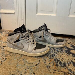 Light blue, silver, black Jordan 1s mid
